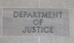 The sign for the U.S. Department of Justice as seen outside the agency's building on Feb. 6, 2026 in Washington, DC.