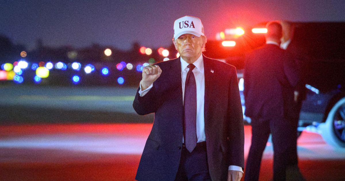 President Donald Trump pumps his fist at Palm Beach International Airport in West Palm Beach, Florida, on Feb. 27, 2026.