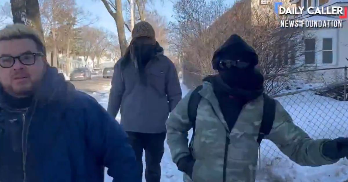 Masked activists assaulted a reporter who was asking questions about the illegal blockade they erected in a Minneapolis neighborhood.