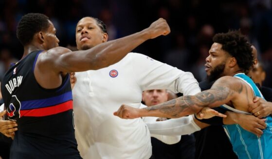 Detroit Pistons center Jalen Duren, left, throws punches with Charlotte Hornets forward Miles Bridges, right, during a fight on the court Monday in the second half of an NBA basketball game in Charlotte, North Carolina.