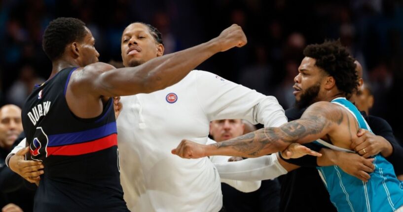 Detroit Pistons center Jalen Duren, left, throws punches with Charlotte Hornets forward Miles Bridges, right, during a fight on the court Monday in the second half of an NBA basketball game in Charlotte, North Carolina.