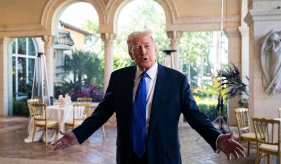 President Donald Trump speaks to the media at Mar-a-Lago Sunday in Palm Beach, Florida.