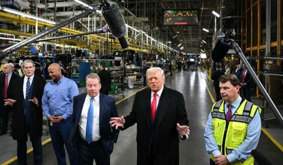 President Donald Trump speaks alongside Ford executive chairman Bill Ford, third from left, Ford CEO Jim Farley, right, Treasury Secretary Scott Bessent, left, and plant manager Corey Williams as he tours Ford Motor Company's River Rouge complex in Dearborn, Michigan, on Jan. 13.