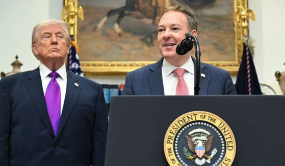 President Donald Trump listens as U.S. Administrator of the Environmental Protection Agency Lee Zeldin, right, speaks as they make an announcement Thursday in the Roosevelt Room of the White House.