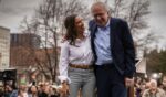 U.S. Rep. Alexandria Ocasio-Cortez of New York and socialist Sen. Bernie Sanders hug on stage in Denver, Colorado, in a March 2025 file photo.