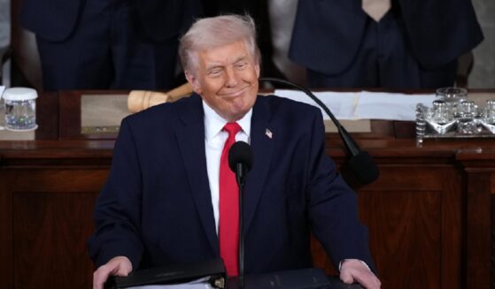 President Donald Trump grins while delivering his State of the Union address Tuesday in the Capitol.