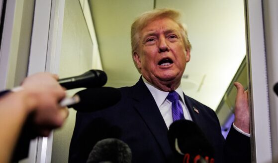 President Donald Trump, pictured speaking to reporters aboard Air Force One on Friday.