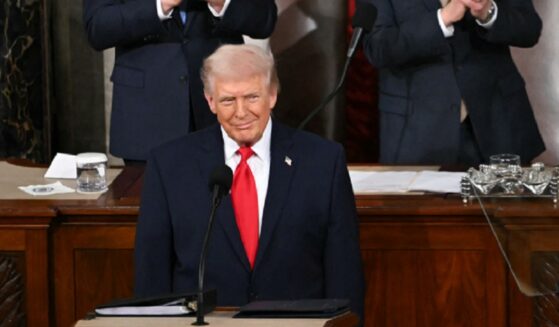 President Donald Trump gives a wry grin as he begins his State of the Union address Tuesday in the Capitol.