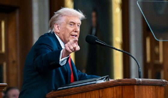 President Donald Trump points an accusing finger at the Democratic side of his audience during Tuesday's State of the Union address in the Capitol.