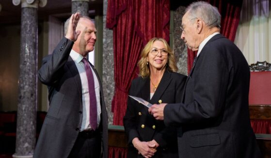 GOP Sen. Alan Armstrong of Oklahoma, accompanied by his wife Shelly, participates in a ceremonial swearing in ceremony Tuesday with Senate President Pro Tempore Charles Grassley, an Iowa Republican, in the Old Senate Chamber at the U.S. Capitol Building in Washington, D.C. Armstrong, a longtime petroleum executive, was sworn in as an interim Senator for Oklahoma to replace Markwayne Mullin, who was tapped to replace Kristi Noem as the new secretary of homeland security.