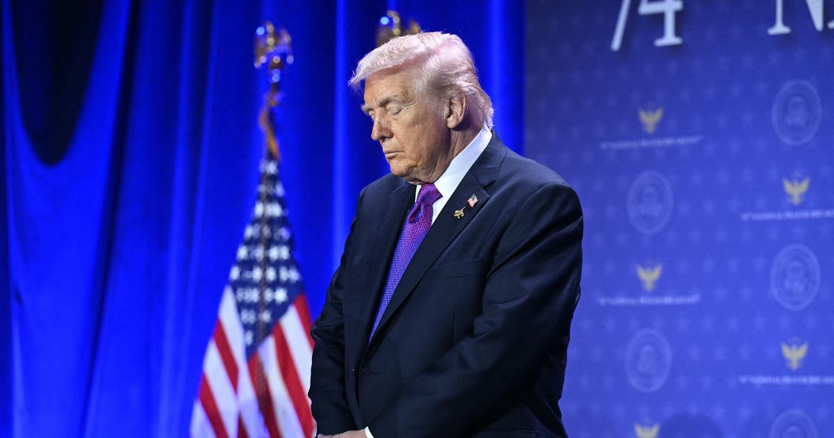 President Donald Trump bows his head in prayer during the National Prayer Breakfast at the Washington Hilton in Washington, D.C., on Feb. 5, 2026.