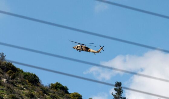 An Israeli Air Force UH-60 Black Hawk helicopter flies over the border area with southern Lebanon in northern Israel on March 2, 2026.