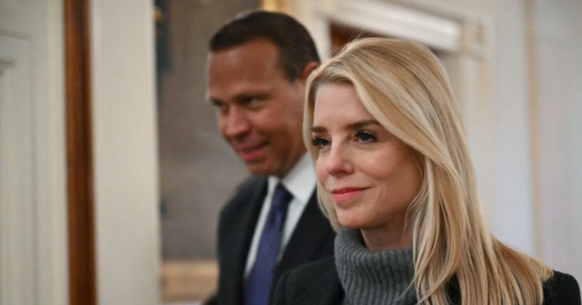 Attorney General Pam Bondi walks in with former professional baseball player Alex Rodriguez to attend an event for Inter Miami CF, winners of the 2025 Major League Soccer Cup, in the East Room of the White House in Washington, D.C., on March 5, 2026.