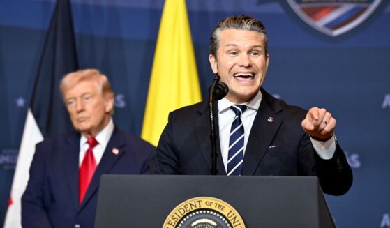 Defense Secretary Pete Hegseth addresses the audience as President Donald Trump listens during the Shield of the Americas Summit, a gathering with heads of state and government officials from 12 countries in the Americas at the Trump National Doral Golf Club on March 7, 2026, in Doral, Florida.