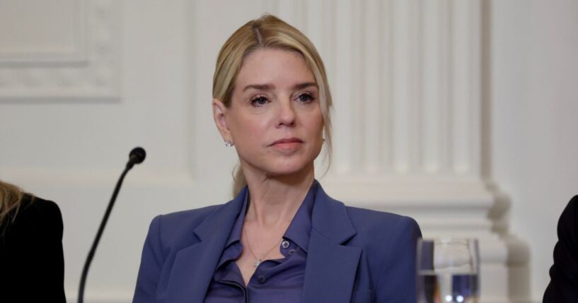 Attorney General Pam Bondi listens as President Donald Trump speaks during a lunch with the Trump Kennedy Center Board Members in the East Room of the White House on March 16, 2026, in Washington, D.C.