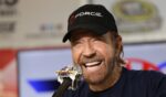 Actor Chuck Norris speaks with the media during a press conference prior to the NASCAR Sprint Cup Series AAA Texas 500 at Texas Motor Speedway on Nov. 6, 2016, in Fort Worth, Texas.