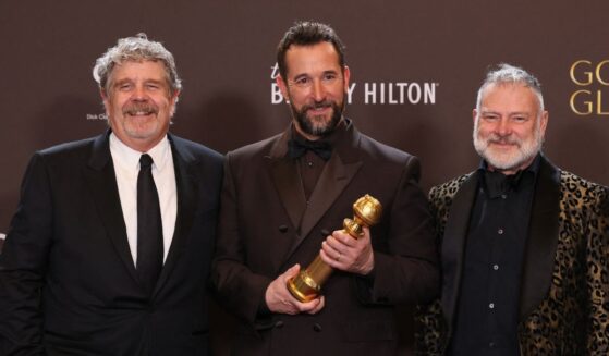 Producer John Wells, actor Noah Wyle, and producer R. Scott Gemmill, winners of the Best Television Series - Drama Award for "The Pitt", pose in the press room during the 83rd annual Golden Globe Awards at the Beverly Hilton hotel in Beverly Hills, California, on Jan. 11, 2026.