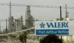 Damage to supply pipes and a sign are seen at the idle Valero oil refinery on Sept. 25, 2005, in Port Arthur, Texas, in the aftermath of Hurricane Rita.