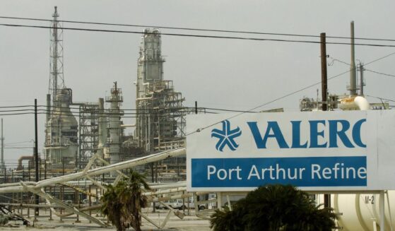Damage to supply pipes and a sign are seen at the idle Valero oil refinery on Sept. 25, 2005, in Port Arthur, Texas, in the aftermath of Hurricane Rita.