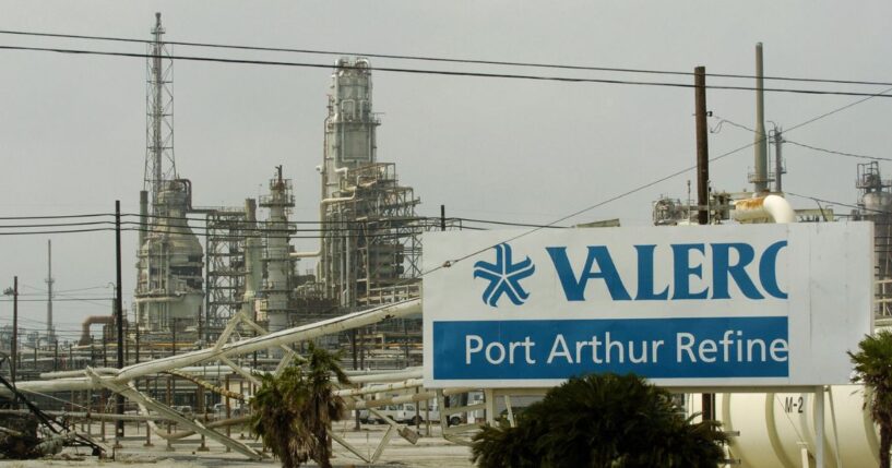 Damage to supply pipes and a sign are seen at the idle Valero oil refinery on Sept. 25, 2005, in Port Arthur, Texas, in the aftermath of Hurricane Rita.