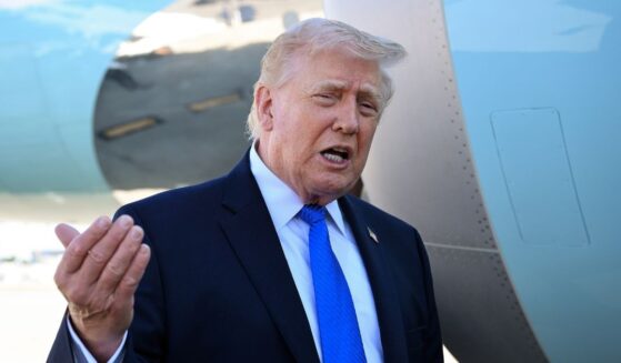 President Donald Trump speaks to reporters before boarding Air Force One at Palm Beach International Airport on March 23, 2026, in West Palm Beach, Florida.