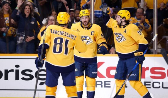 Filip Forsberg, Jonathan Marchessault, and Roman Josi of the Nashville Predators celebrate after a goal during the first period of the game against the San Jose Sharks at Bridgestone Arena on March 24, 2026, in Nashville, Tennessee.