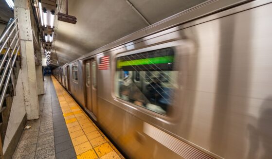 Subway train arriving at station in New York City underground transportation system.