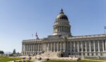 The Utah State Capitol building in Salt Lake City, Utah, with its distinctive copper dome and neoclassical columns.