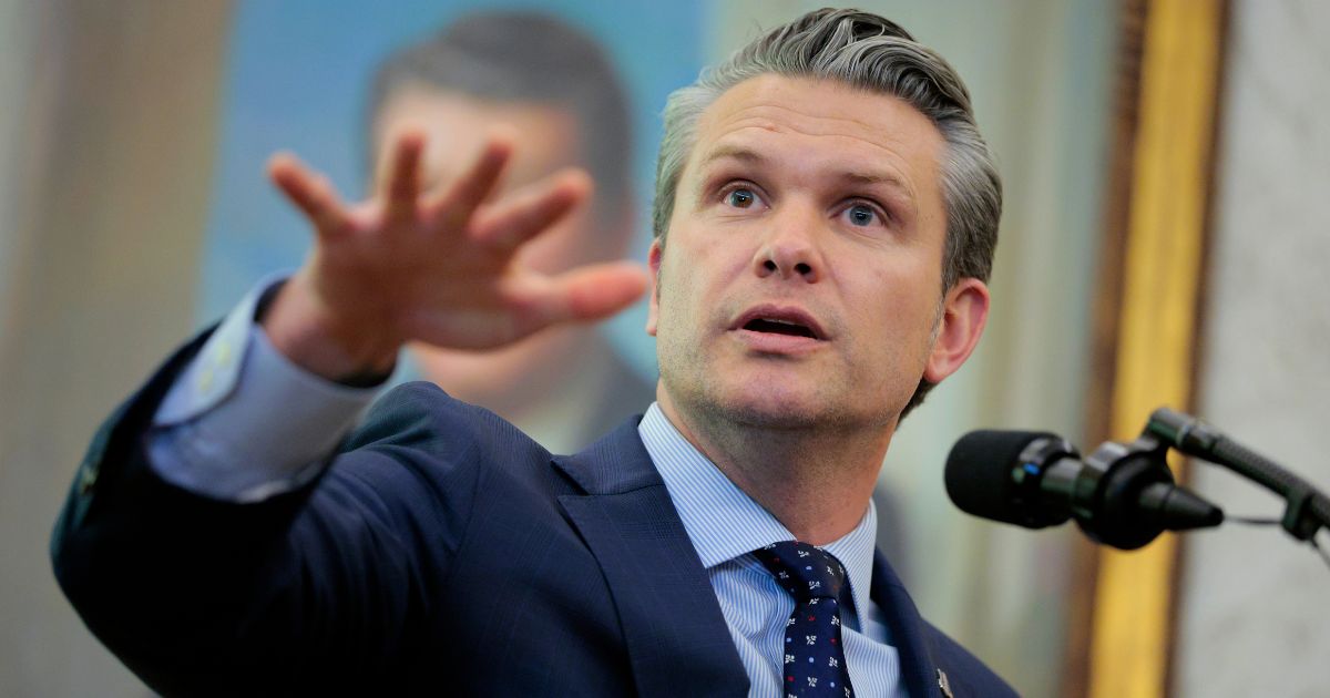 Secretary of War Pete Hegseth answers questions in the Oval Office at the White House on March 24, 2026, in Washington, D.C.