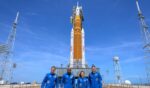 In this handout provided by NASA, NASA astronauts Reid Wiseman, Artemis II commander, left, Victor Glover, Artemis II pilot, Christina Koch, Artemis II mission specialist, and Canadian Space Agency astronaut Jeremy Hansen, Artemis II mission specialist, right, stop for a group photograph as they visit NASA's Artemis II Space Launch System rocket and Orion spacecraft, on March 30, 2026, in Cape Canaveral, Florida.