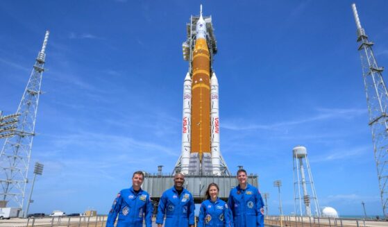 In this handout provided by NASA, NASA astronauts Reid Wiseman, Artemis II commander, left, Victor Glover, Artemis II pilot, Christina Koch, Artemis II mission specialist, and Canadian Space Agency astronaut Jeremy Hansen, Artemis II mission specialist, right, stop for a group photograph as they visit NASA's Artemis II Space Launch System rocket and Orion spacecraft, on March 30, 2026, in Cape Canaveral, Florida.