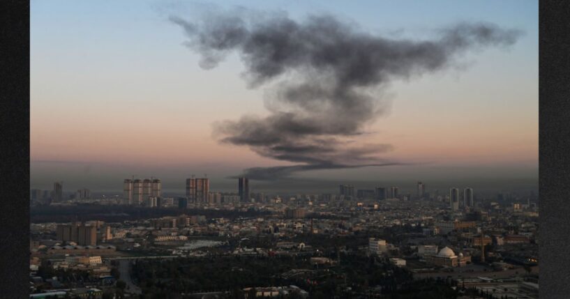 A plume of smoke rises Sunday near Erbil International Airport in Erbil, Iraq. Loud explosions were heard early on March 1 near Erbil airport, which hosts U.S.-led coalition troops in Iraq's autonomous Kurdistan region, an AFP journalist said. On Wednesday, reports circulated that Iraqi Kurds are initiating a ground offensive against Iran.