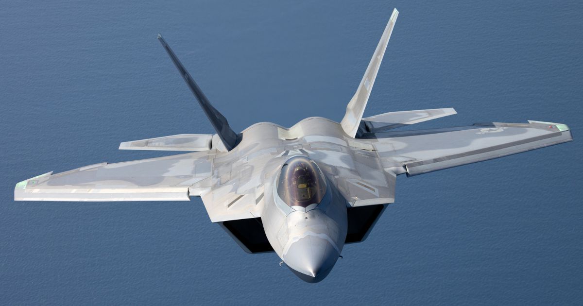 A U.S. F-22 Raptor is seen in a stock photo flying over the Pacific Ocean. Spain has closed its airspace to U.S. planes involved in the Iran war.