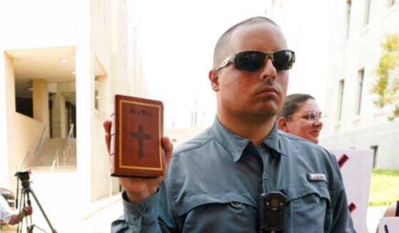 The Supreme Court ruled unanimously in favor of Christian street preacher Gabriel Olivier, seen holding a Bible during a 2022 anti-abortion protest at Hinds County Chancery Court in Jackson, Mississippi.