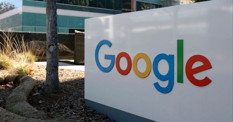 A sign is posted at Google headquarters in Mountain View, California. Three Iranian immigrants have been accused of conspiring to commit trade secret theft from Google and other leading technology companies.