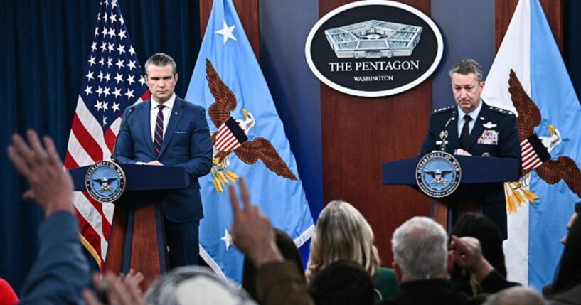 Secretary of War Pete Hegseth, left, and the Chairman of the Joint Chiefs of Staff General Dan Caine, right, take questions during a news conference Monday on U.S. military action in Iran, at the Pentagon in Washington, D.C.