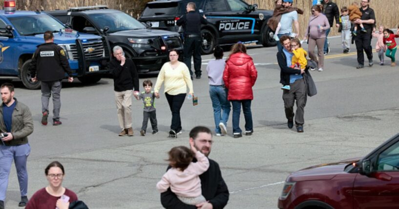 People leave Temple Israel Synagogue following the deathly attack on place of worship.