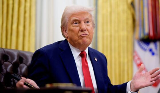 President Trump shrugs in the Oval Office at the Resolute Desk on March 31, 2025.