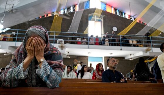 Christian attendees of a church in Islamabad pray on April 20, 2025.