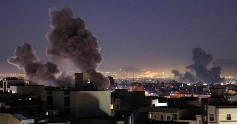 Smoke plumes rise over Tehran following missile strikes from both the United States and Israel's militaries on March 1, 2026.