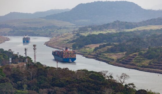 Cargo ships travel through the Panama Canal on March 26, 2019.