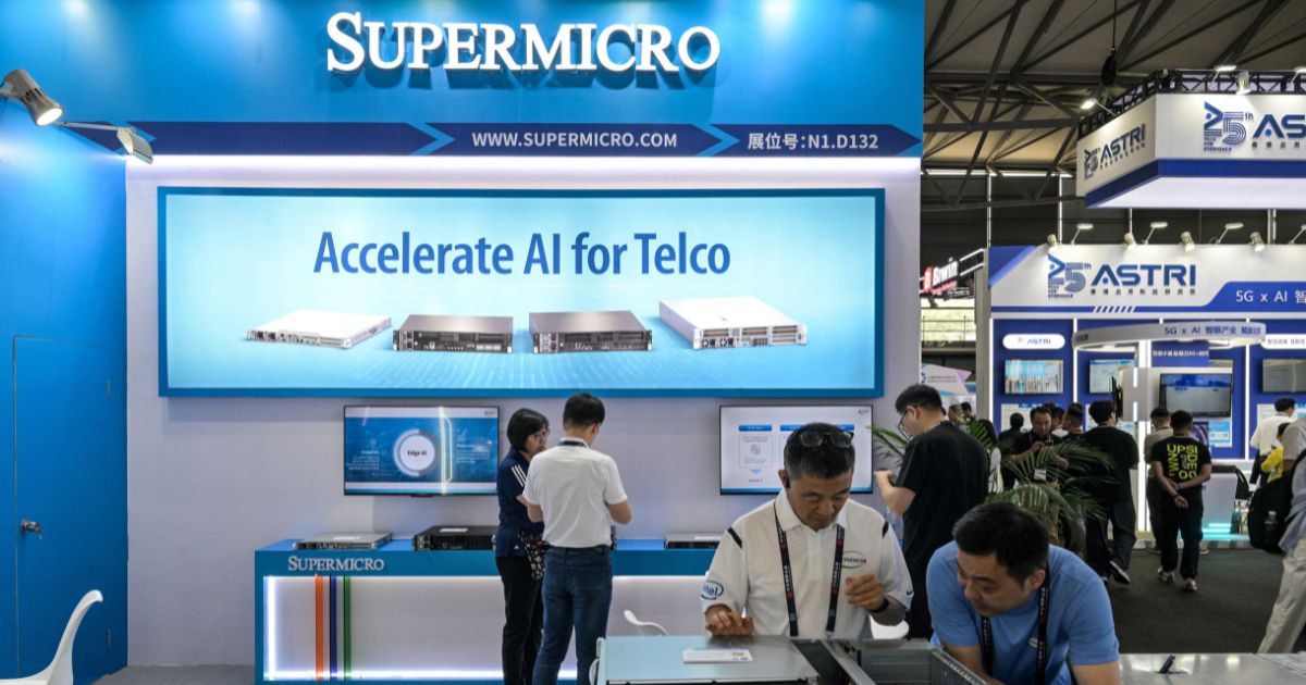 Attendees of the Mobile World Congress visit the Supermicro stand in Shanghai on June 18, 2025.