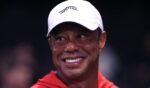 Tiger Woods smiles at a golf match at SoFi Center in Palm Beach Gardens, Florida, on March 23, 2026.