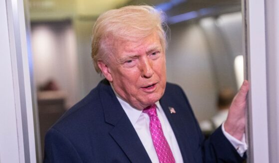 President Donald Trump speaks with reporters onboard Air Force One on March 29, 2026 while heading for Joint Base Andrews, Maryland, from West Palm Beach Florida.