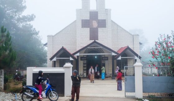 Christian churchgoers leave a church in Loimwe, Shan State, Myanmar on April 2, 2017.