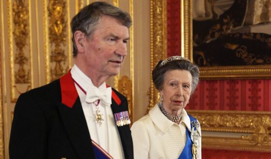 Vice Admiral Sir Tim Laurence and Princess Anne, sister of King Charles III, attend the state banquet for President of Nigeria Bola Ahmed Tinubu and First Lady Oluremi Tinubu at Windsor Castle, Berkshire, on Wednesday in Windsor, England. Anne wore a white ensemble that she first wore in public in 1969.