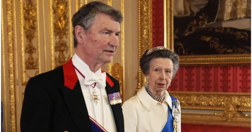 Vice Admiral Sir Tim Laurence and Princess Anne, sister of King Charles III, attend the state banquet for President of Nigeria Bola Ahmed Tinubu and First Lady Oluremi Tinubu at Windsor Castle, Berkshire, on Wednesday in Windsor, England. Anne wore a white ensemble that she first wore in public in 1969.