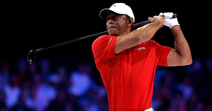 Tiger Woods plays a shot on the ninth hole at SoFi Center on Tuesday in Palm Beach Gardens, Florida. Woods was reportedly involved in a rollover car accident Friday on Jupiter Island, Florida.
