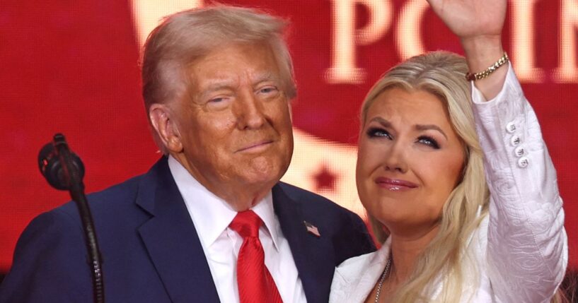 President Donald Trump and Erika Kirk are pictured together in a Sept. 21 photo at the memorial for Kirk's husband, Charlie. Trump has appointed Erika Kirk to take her husband's place on the Air Force Academy Board of Visitors.