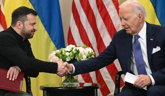 Ukrainian President Volodymyr Zelenskyy, left, shakes hands with then-Ppresident Joe Biden on June 7, 2024, during a bilateral meeting in Paris.